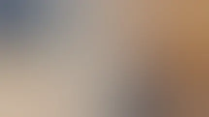 A man reads a novel in bed to wind down before falling asleep.