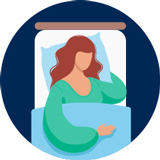 A woman goes to sleep in her bed.