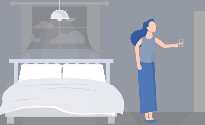 Woman dims the bedroom lights