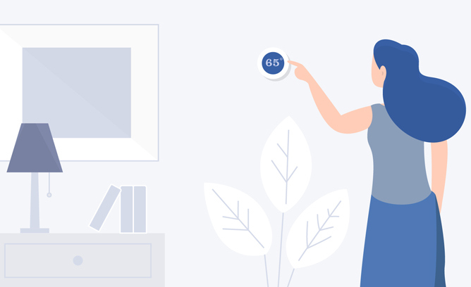 A woman turns the temperature down in her home.