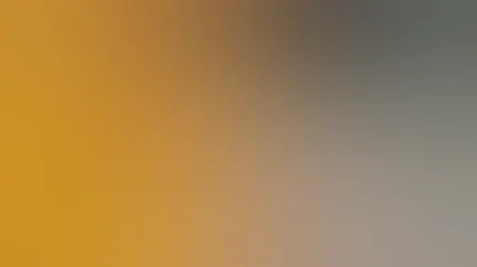 A person studies the label on their medication bottle.