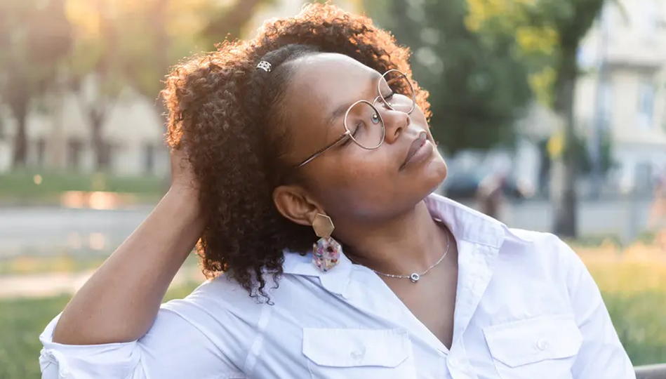 A woman listens to her body to figure out if she's experiencing a migraine or a headache.