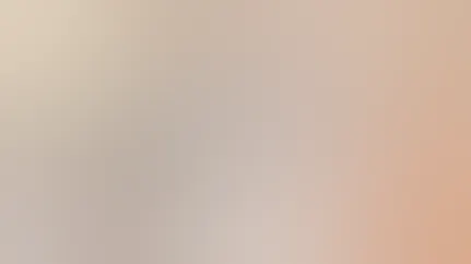 Two women practice yoga in the living room of a house.