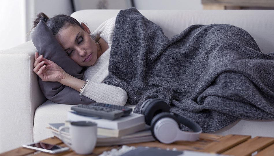 A woman takes a power nap on a Saturday afternoon.