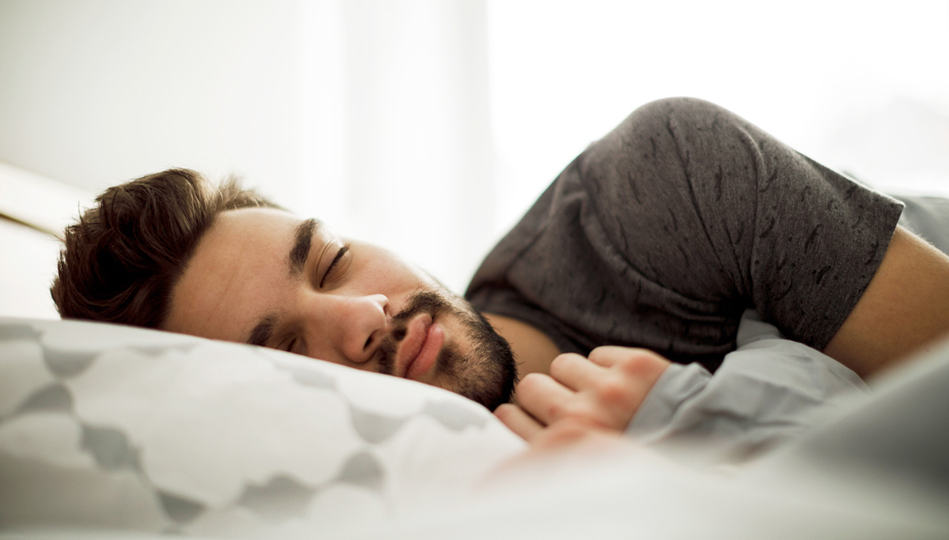 A man sleeps restfully.