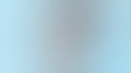 A woman prepares a recipe from the MOBE Menu Guide.