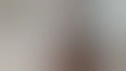 A man reads the label on his supplement bottle.