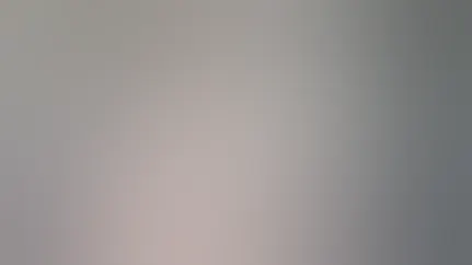 A woman inspects her medication bottle.